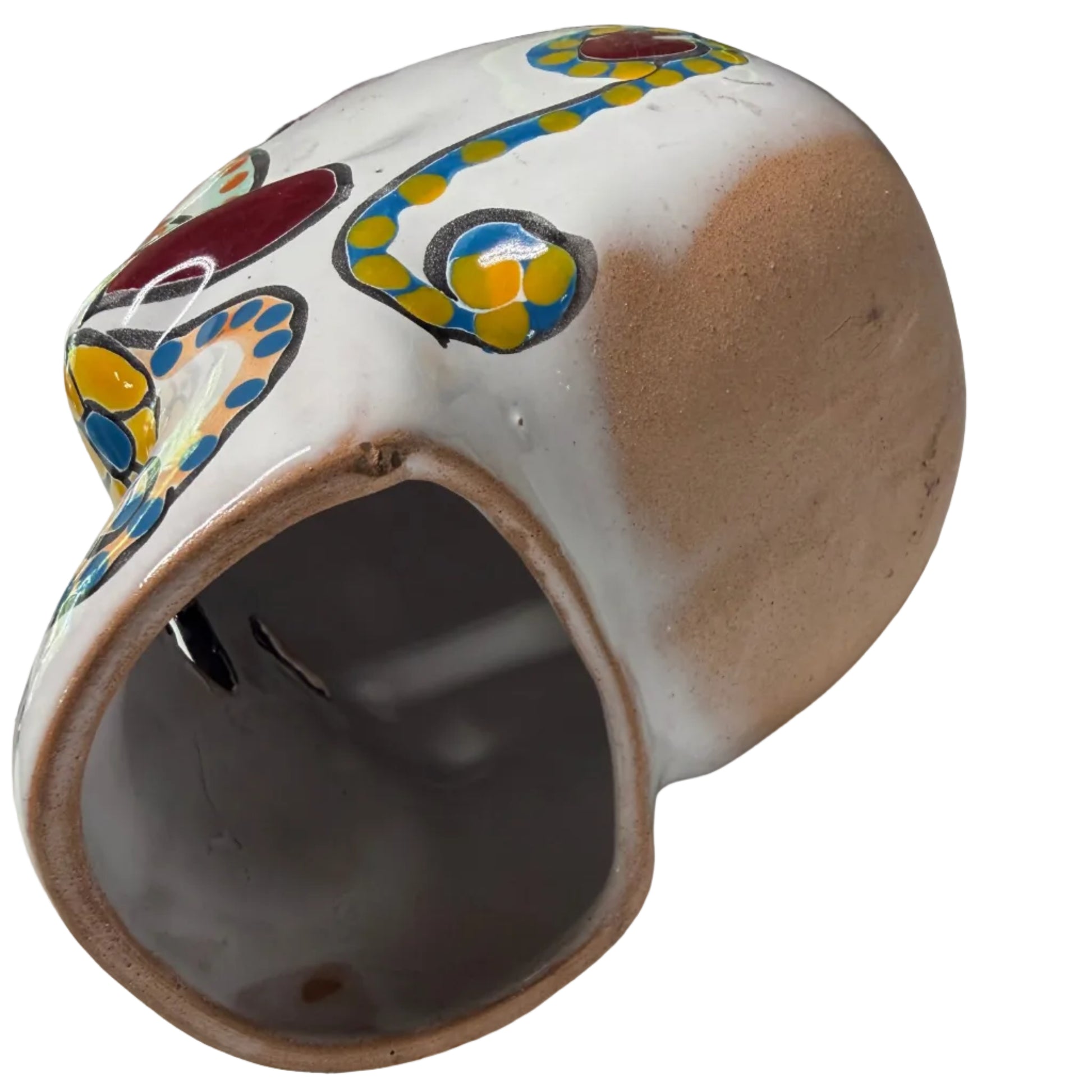 Ceramic pot with colorful designs on a white surface